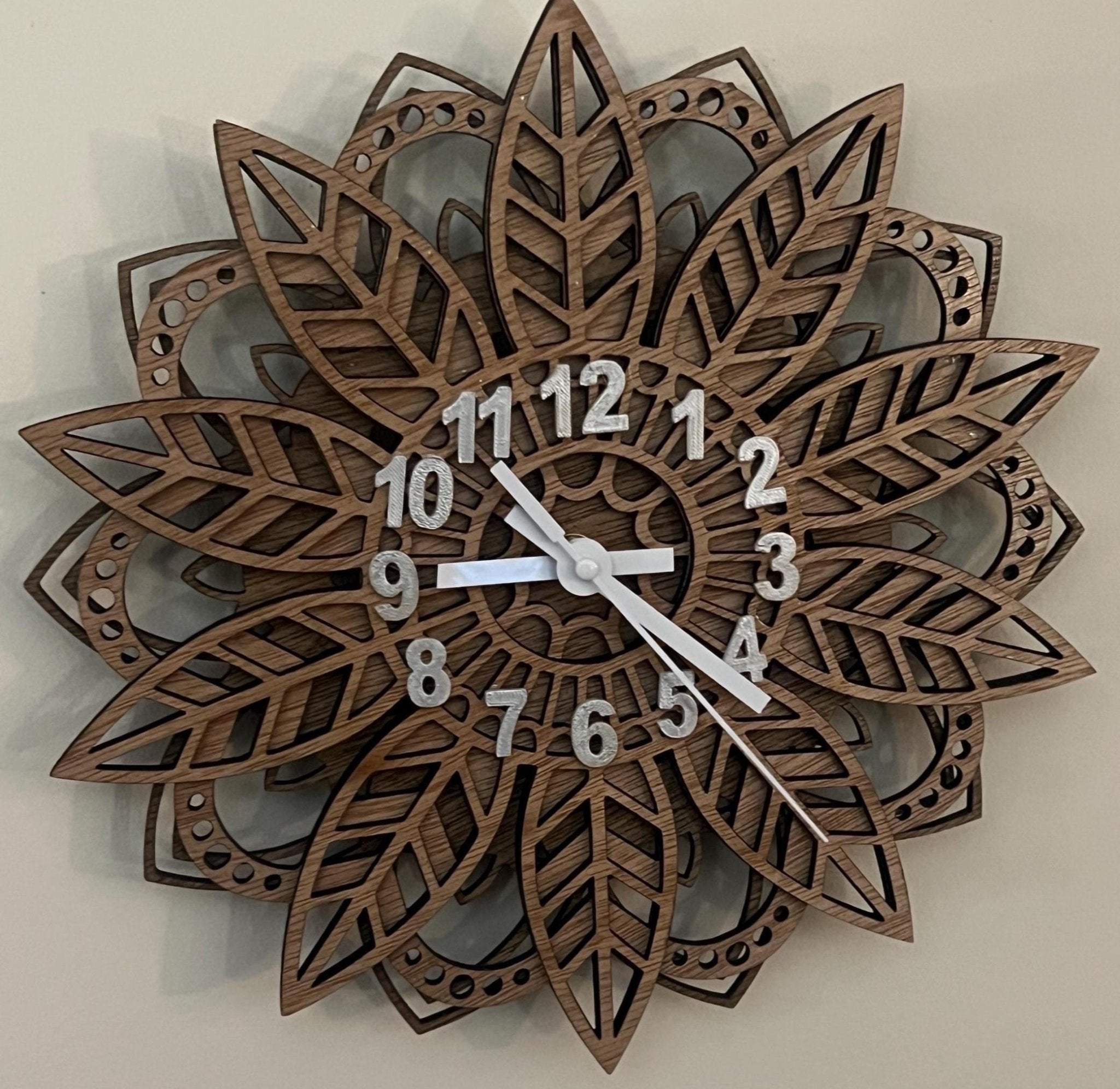 Handcrafted nature wall clock with layered wood leaf design, 12 inches